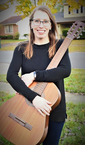 woman holding a guitar